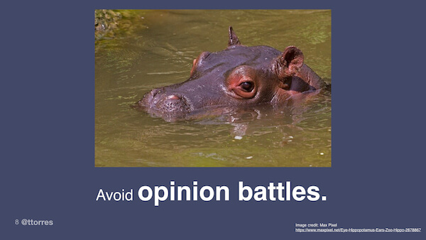 A photograph of a hippo with the caption "Avoid opinion battles"
